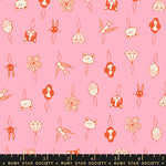 Patterned fabric with small illustrations on a pink background, featuring a ruler at the bottom.