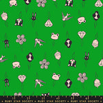 Patterned fabric with cartoon-like illustrations on a green background, featuring animals, flowers, and geometric shapes.