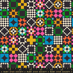 Colorful geometric pattern fabric with a ruler at the bottom, featuring the Ruby Star Society label.