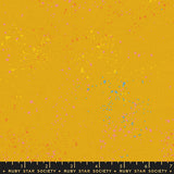 specs scattered on yellow canvas