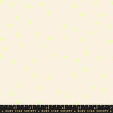Fabric pattern with small green shapes on a beige background, featuring Ruby Star Society label.