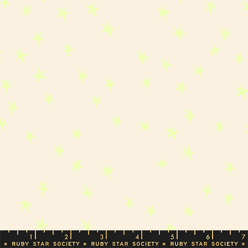 Fabric pattern with small green shapes on a beige background, featuring Ruby Star Society label.