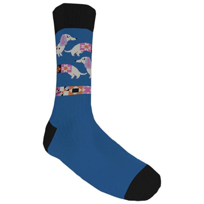 A single crew sock with a blue body, black toe, heel, and cuff, featuring a patterned band with stylized dachshund dogs and geometric shapes.