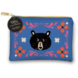 A blue zippered pouch featuring a black bear face illustration and pink, orange, and white decorative motifs, with a gold zipper and a hanging circular tag reading Sarah + Wyatt x Crafted Moon.