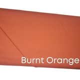Confetti Cotton Burnt Orange Solid Fabric by Riley Blake