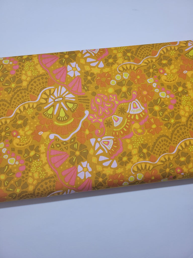 Modern floral print on a gold background; 100% cotton