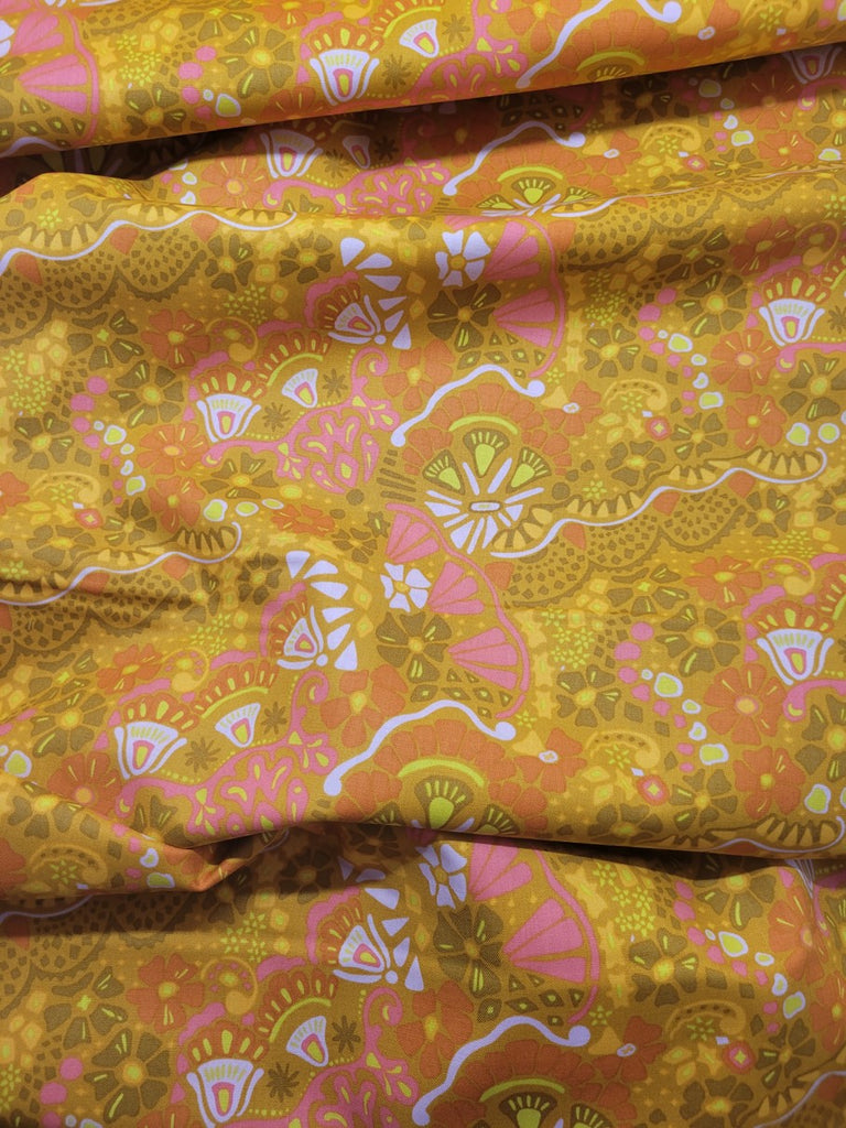 Modern floral print on a gold background; 100% cotton